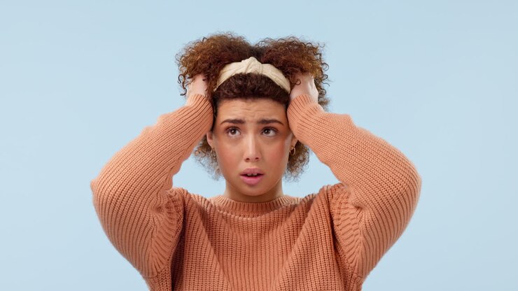 Anxiety, thinking and face of sad woman in studio