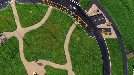 modern circular cemetery pathway design aerial view artistic garden of rest slowly rising