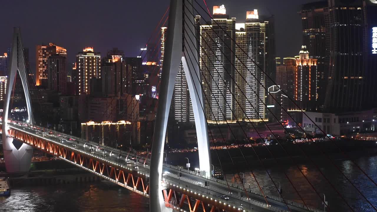Night view of Chongqing’s stunning urban skyline, showcasing the illuminated cityscape, modern architecture. This footage captures the city’s dynamic energy at night