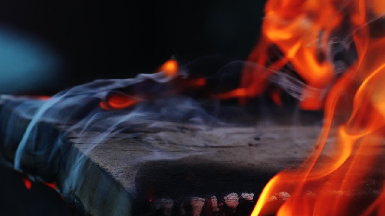 Flaming and burning dangerous fire. Burning firewood. Slow motion