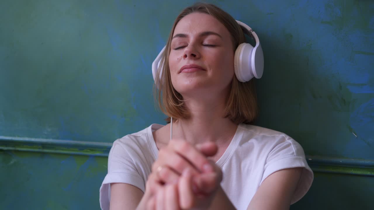 Girl enjoying her favorite song in headphones