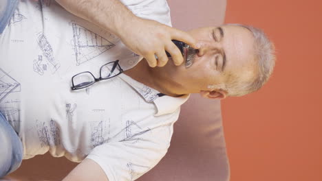 Vertical-video-of-The-old-man-who-puts-on-perfume-and-smells-good.