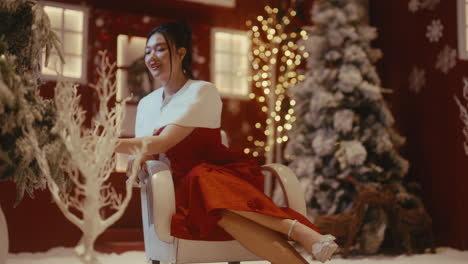 woman in a red dress in a christmas setting