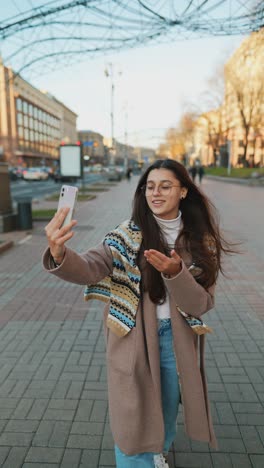 woman video calling on the street