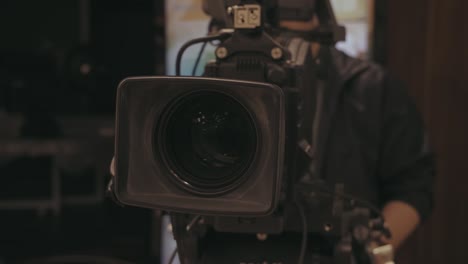 behind the scene. cameraman shooting film or tv show with camera