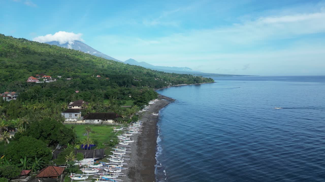 Half sea, half island views with volcanic mountain views on a hot summers day in Bali, Indonesia