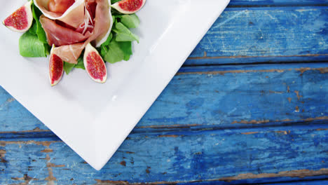 Raw-meat-and-vegetables-decorated-on-plate