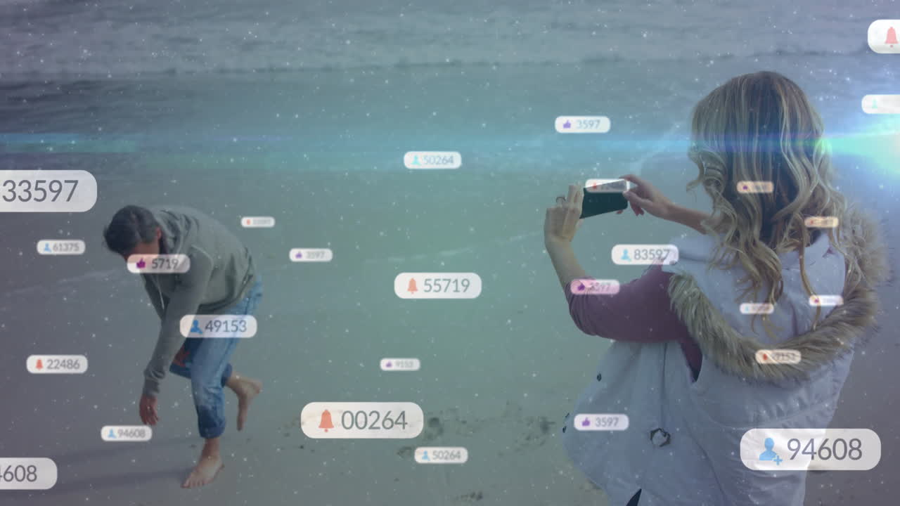 At beach, people relaxing with social media notifications overlay on screen