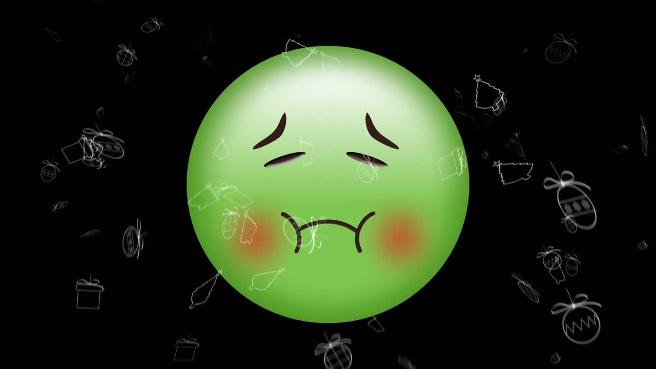 검은색 배경에 움직이는 크리스마스 아이콘 위에 아픈 이모지 아이콘의 애니메이션