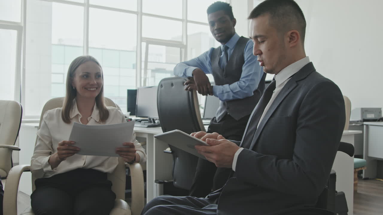 Businessman and Colleagues Discussing Work