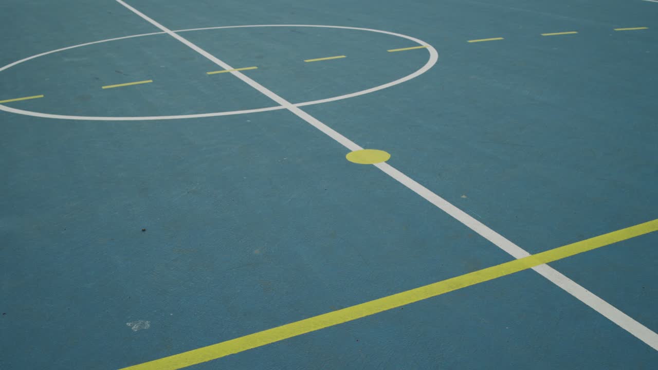 Markings on the ground of an outdoor court in sport center