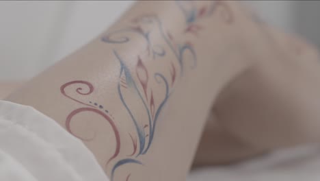 painted floral design on a leg