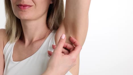 Woman showing her armpit
