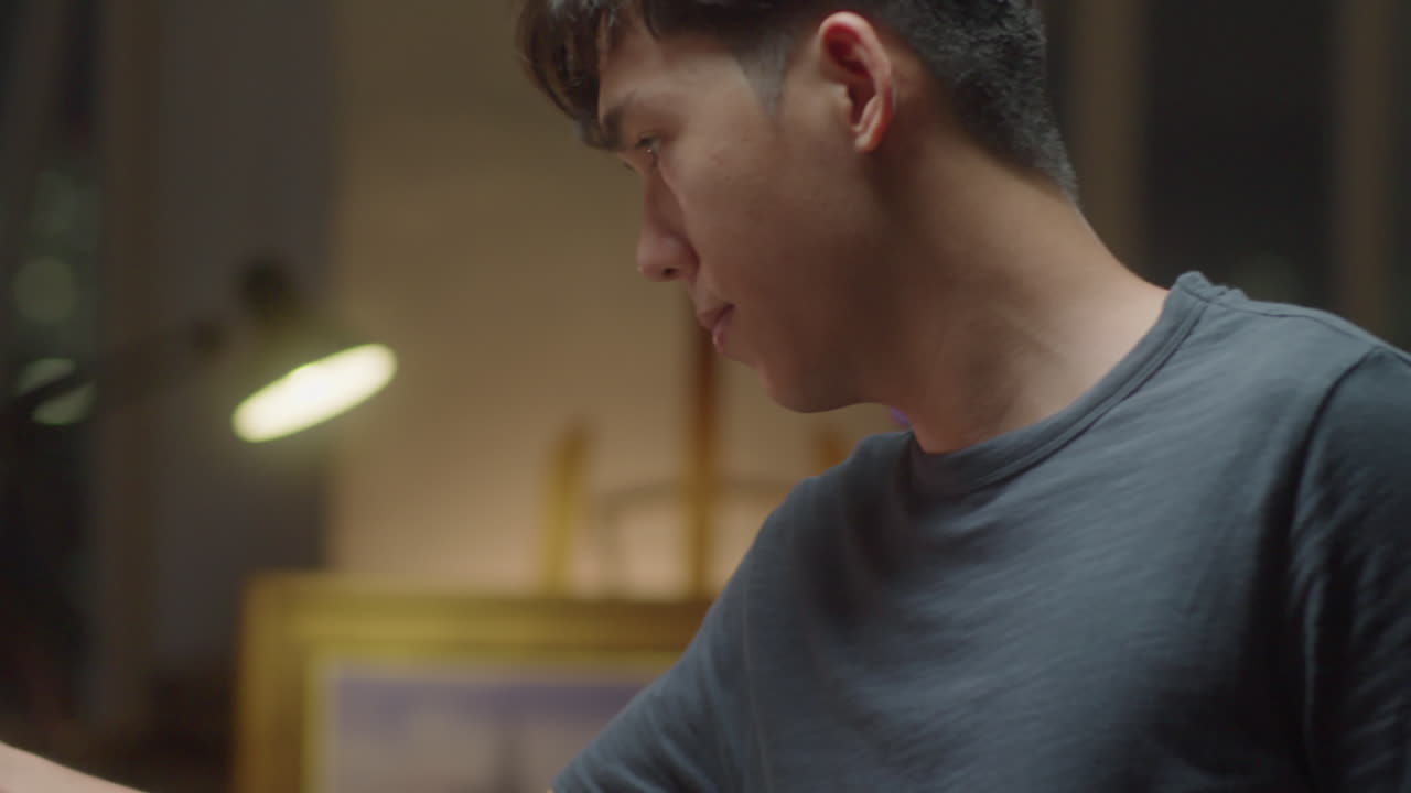 Asian Artist Painting Cityscape on Canvas