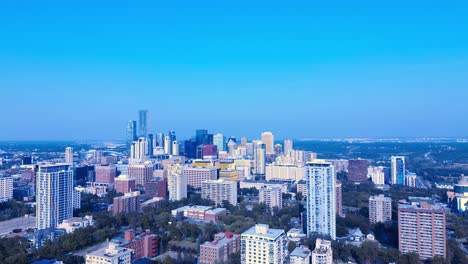 3-3-Edmonton-Downtown-Summer-flyover-residential-towers-schools-hotels-government-buildings-condominiums-surrounded-by-lush-green-parks-on-a-clear-day