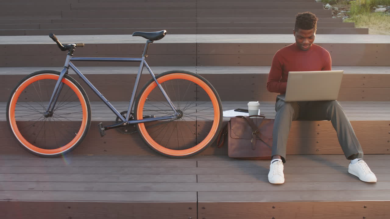 African American Businessman Working on Laptop Outdoors
