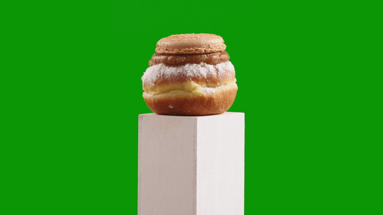 Caramel and classic alfajores flavors Jelly Doughnut, Sufganiyah blend seamlessly in this elegant doughnut creation on chroma key or green screen