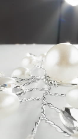 luxurious pearl and crystal necklace sparkling under a radiant light on a sleek surface
