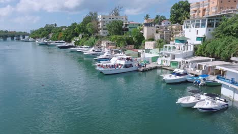 flying over rio romana river water surface and yachts in dominican republic