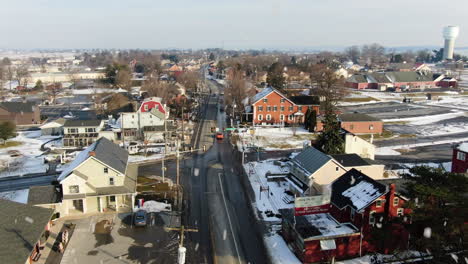 aerial orbital downtown intercourse pa, usa during snowfall