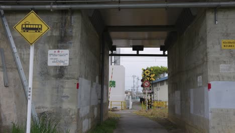 train crossing underpass in rural shiga japan