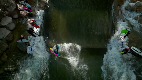 Salida-Colorado-aerial-cinematic-drone-river-surfing-scout-wave-summer-downtown-S-Lime-Mill-near-Buena-Vista-on-Arkansas-River-Riverside-Park-community-rafting-Rocky-Mountain-looking-down-up-movement