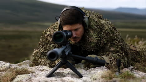 sniper in camouflage