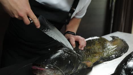 chef preparing a fish