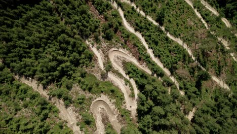 Aerial-drone-point-of-view-of-a-MTB-bicycle-trail-in-the-mountains-of-Dolni-Morava,-Czech-Republic