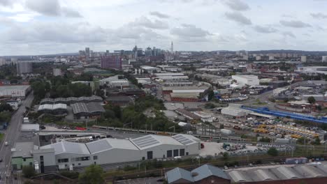 drone shot tracking train through industrial estate 02