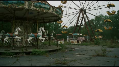 abandoned amusement park's carousel and ferris wheel: a haunting glimpse into forgotten joys and decayed dreams surrounded by nature's reclaiming embrace
