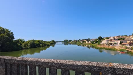 peaceful river scene in castillon-la-bataille, france