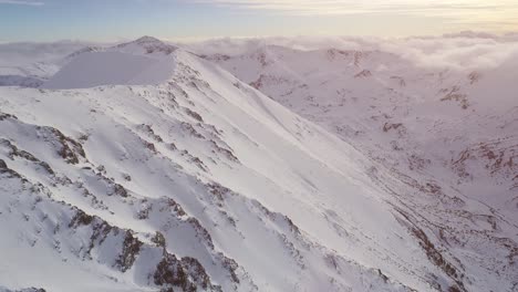 snowy mountain peaks and cloudscape