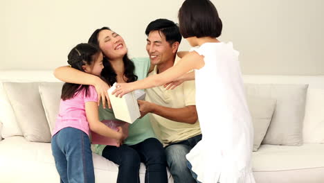 cute family giving their mother presents