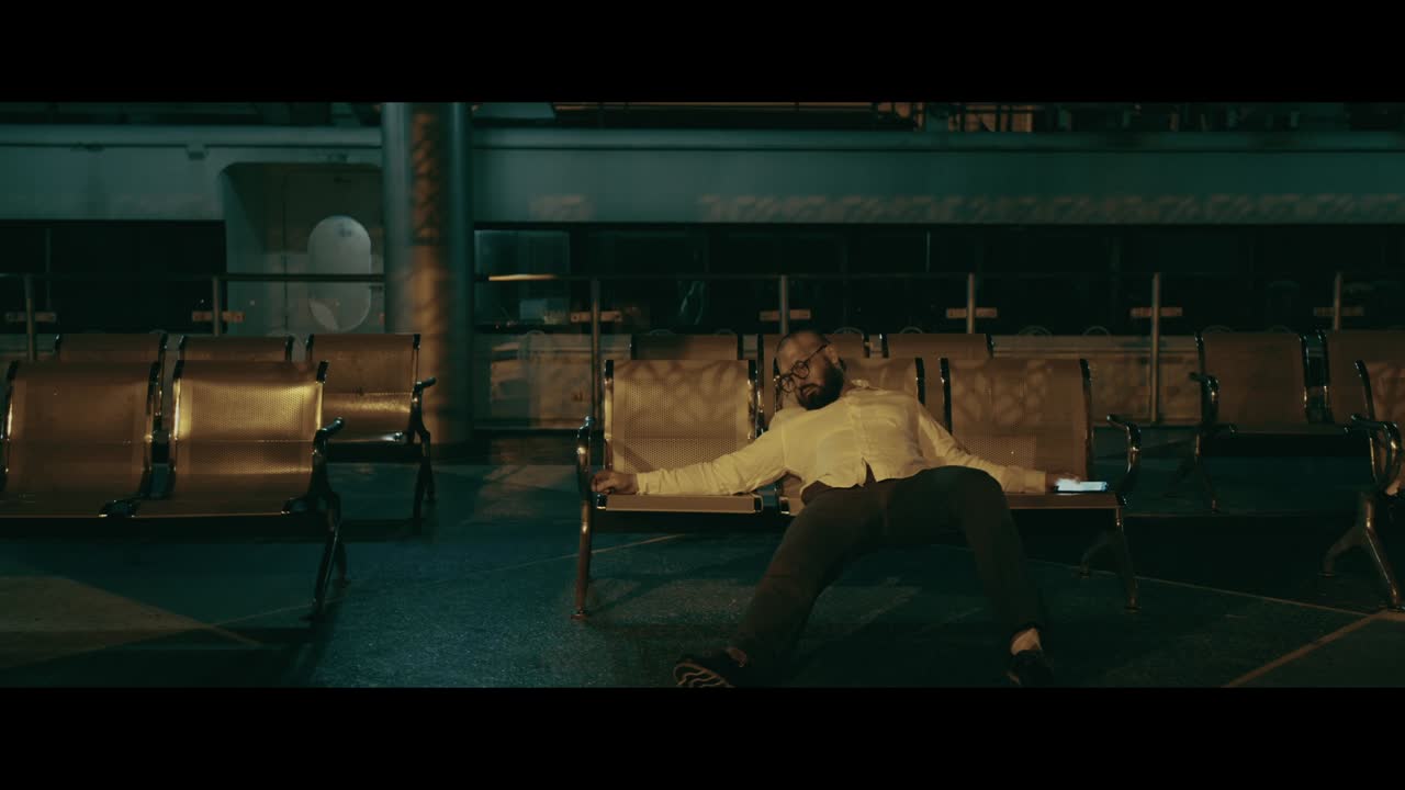 Man Waiting on Ferry at Night