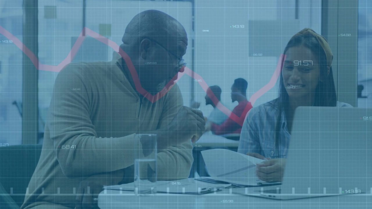 Senior man leaning as woman showing biz report mentoring laptop edits while red graph animating