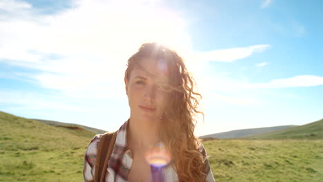 smiling woman hiking in mountains