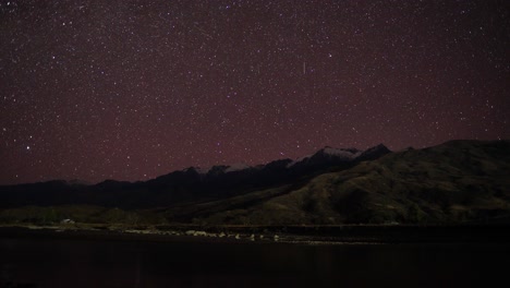 time lapse of the mountain on the night and sky full with stars