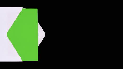 white letter envelope containing a green paper enters and exits the scene from the left screen site