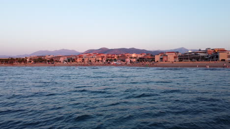 Flying-Away-From-The-Beach-In-Analipsi-During-Sunset-In-Crete,-Greece