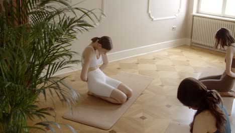 women practicing yoga together in a studio