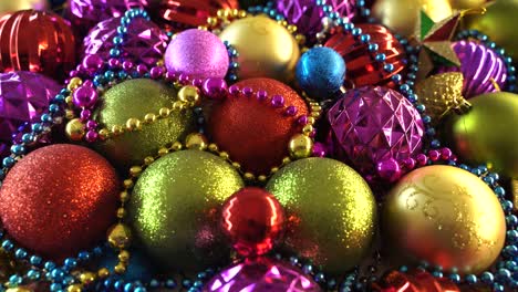 many colorful new year balls arranged on the table. merry christmas balls baubles decoration colors. close up