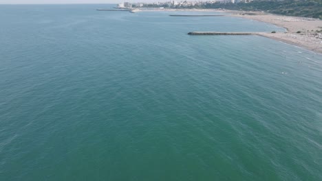 Yacht-In-A-Scenic-Seascape-In-Constanța,-Romania---aerial-drone-shot