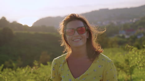 woman enjoying sunset in a yellow dress