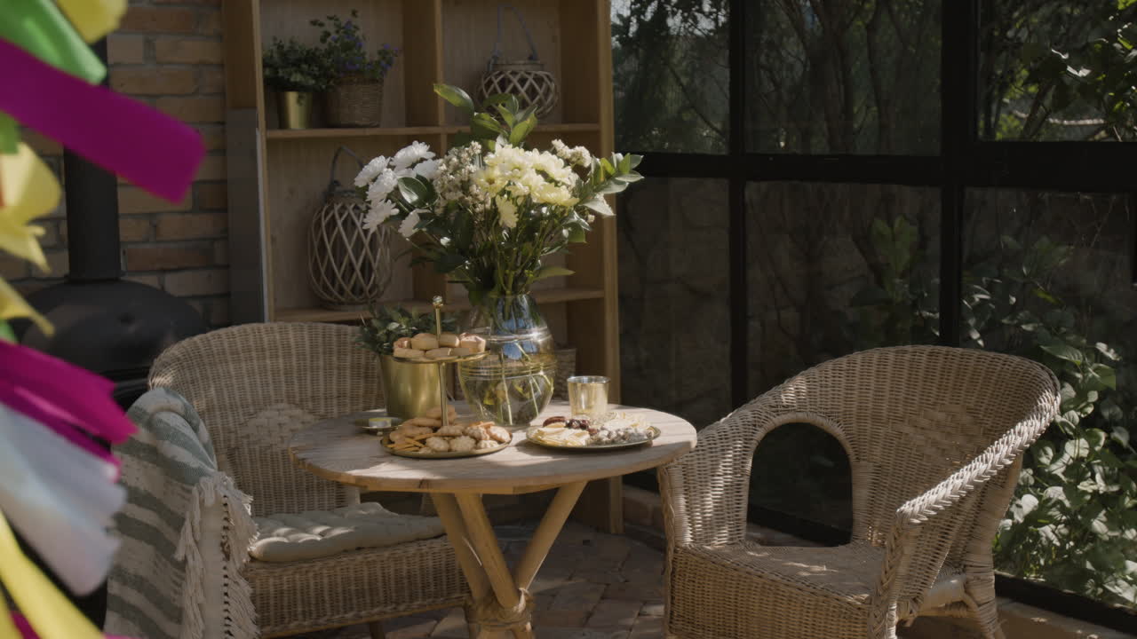 Charming Patio Setting with Snacks, Flowers, and Party Decorations
