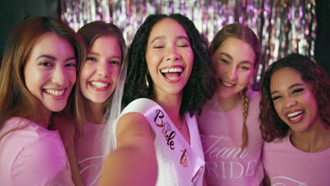 bride and bridesmaids selfie at hen party