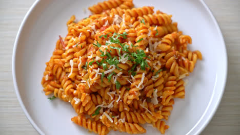 spiral or spirali pasta with tomato sauce and cheese - italian food style