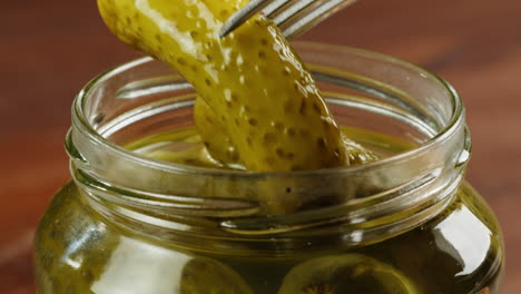 pickles in a jar with fork