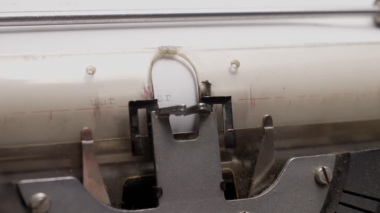 A close-up shot of a typewriter imprinting words on paper, capturing vintage writing