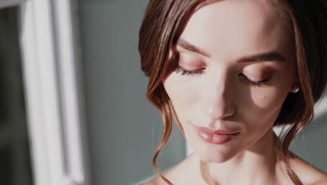 beautiful woman with elegant makeup and hairstyle